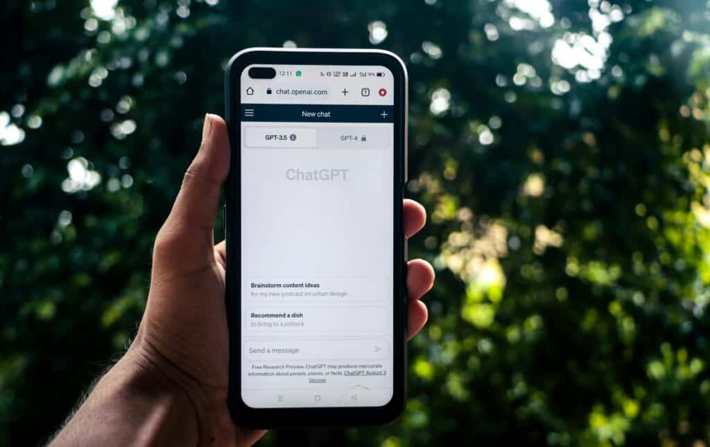pexels-photo-17887854-17887854 Webpage of ChatGPT, a prototype AI chatbot, is seen on the website of OpenAI, on a smartphone. Examples, capabilities, and limitations are shown.